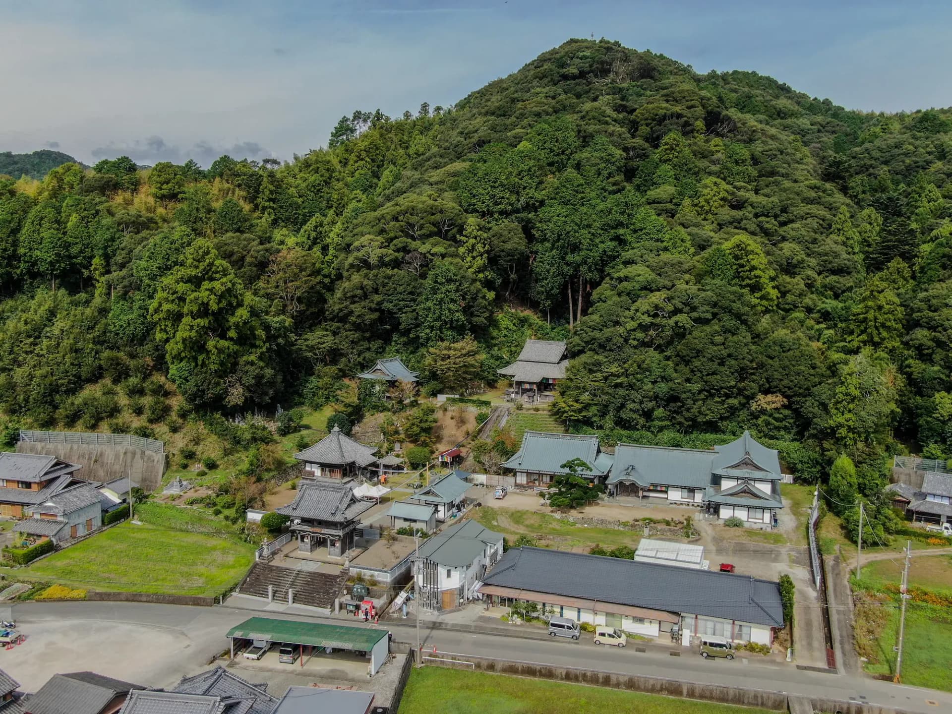 A full view of Byodoji Temple at the foot of the mountain